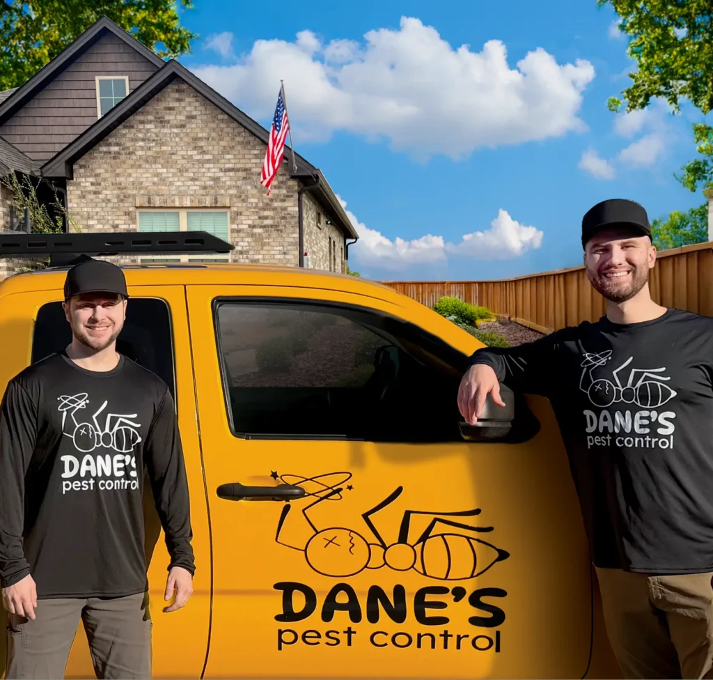 Owners of Dane's Pest Control Standing with a service truck